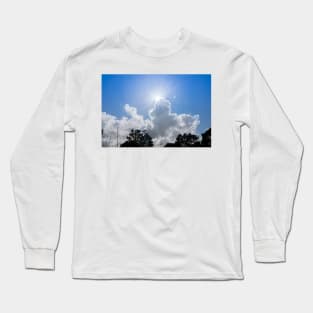 Sun bursts above cloud against blue sky. Long Sleeve T-Shirt